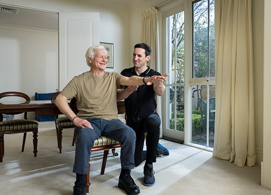 Remedy employee doing some rehab with a male client in their house
